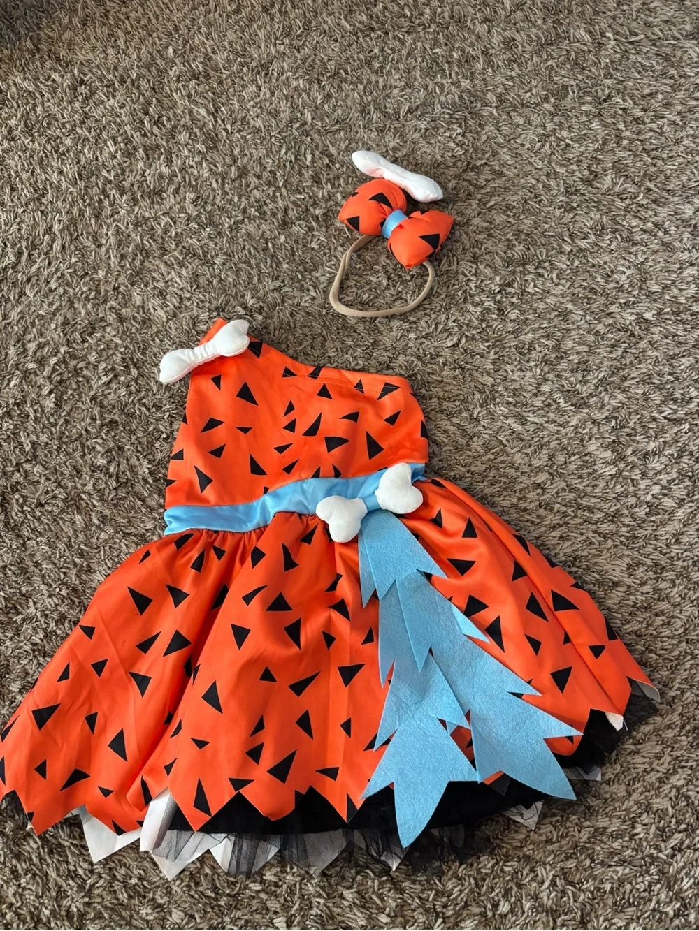 Orange Pebbles-Style Kids Costume Dress with Blue Sash and Bone Accents